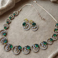 Jewelry set with necklace and earrings on a beige fabric background